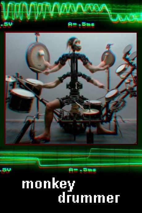    Video installation depicting a robotic contraption with a monkey’s head playing the drums along to music by Aphex Twin.  